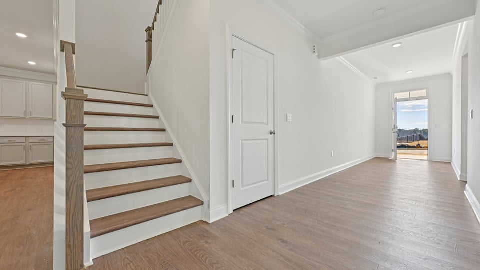 staircase with open railing and revwood stairs