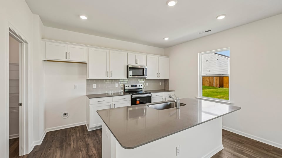 kitchen with island and white cabinets