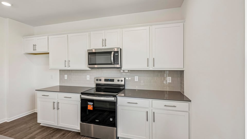 kitchen with white cabinets and quartz countertops