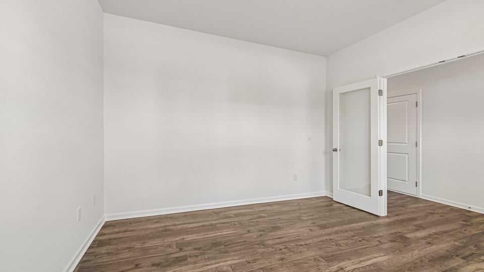 study with revwood flooring and french doors