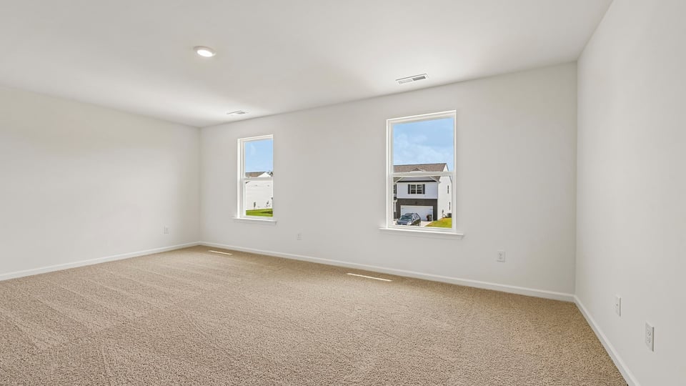 primary bedroom with carpet flooring
