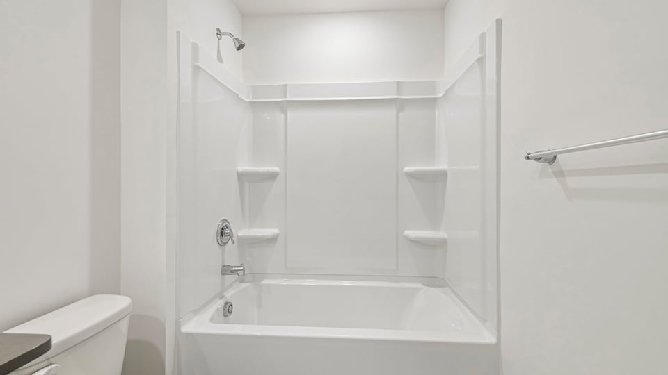 bathroom with tub shower combo