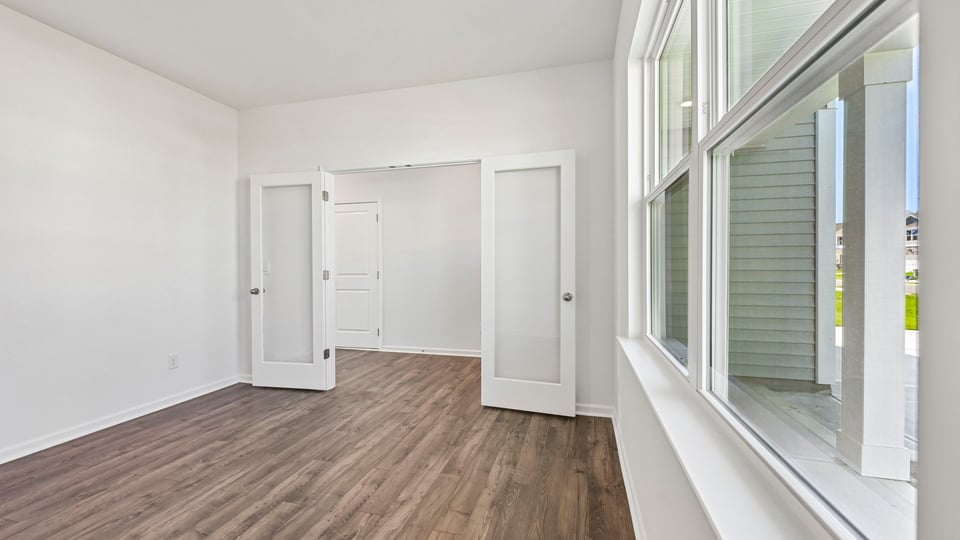 study with french doors and revwood flooring