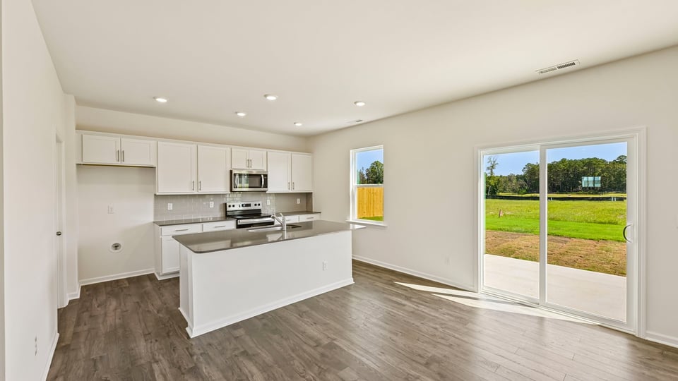kitchen and dining area with sliding glass doors to patio