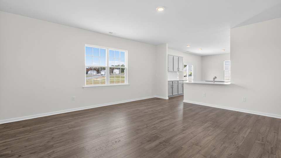 open concept living space with large windows