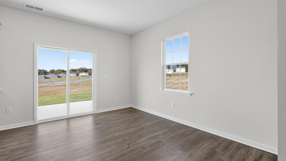 open concept dining space with sliding glass door to patio