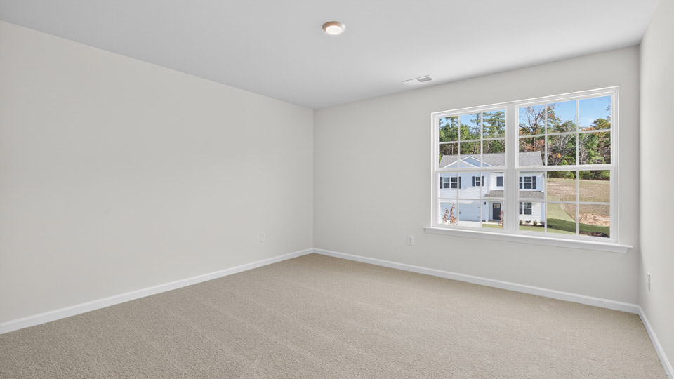 additional bedroom with window, carpeting, closet