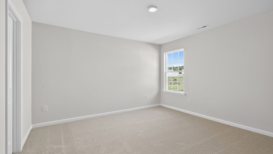 additional bedroom with window, carpeting, closet