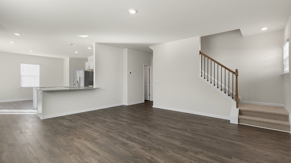 LIVING ROOM AND STAIRWELL
