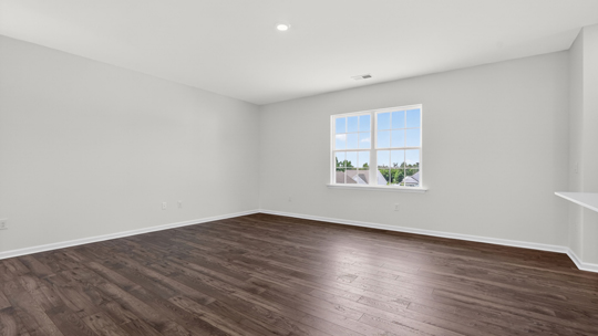 open concept living space with large windows