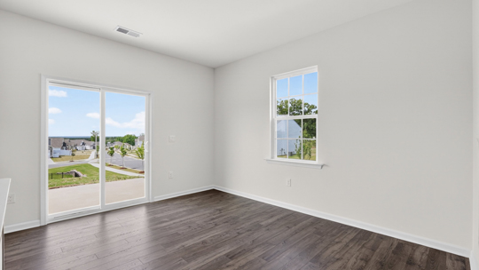 open concept dining space with door to patio