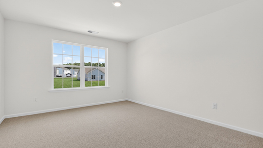 additional bedroom with window, carpeting, closet