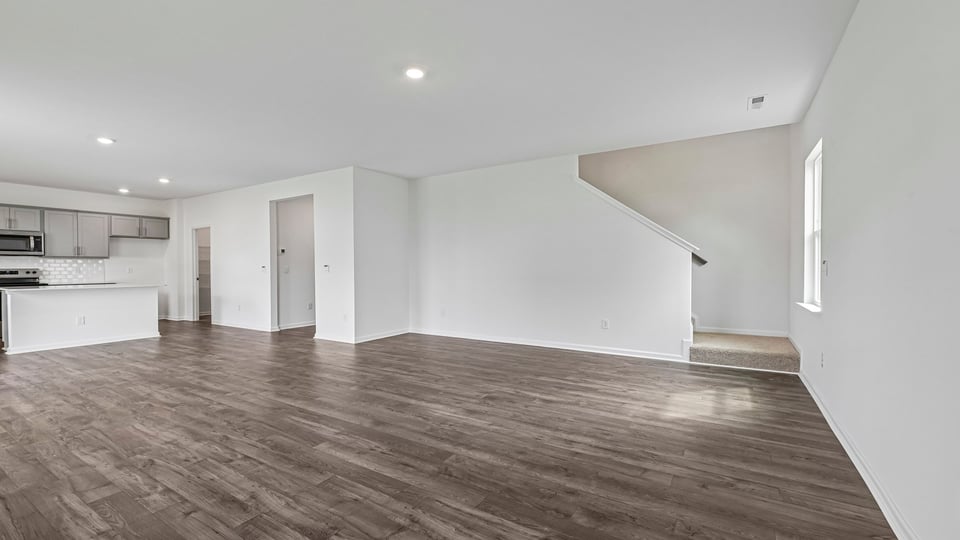 living room with revwood flooring