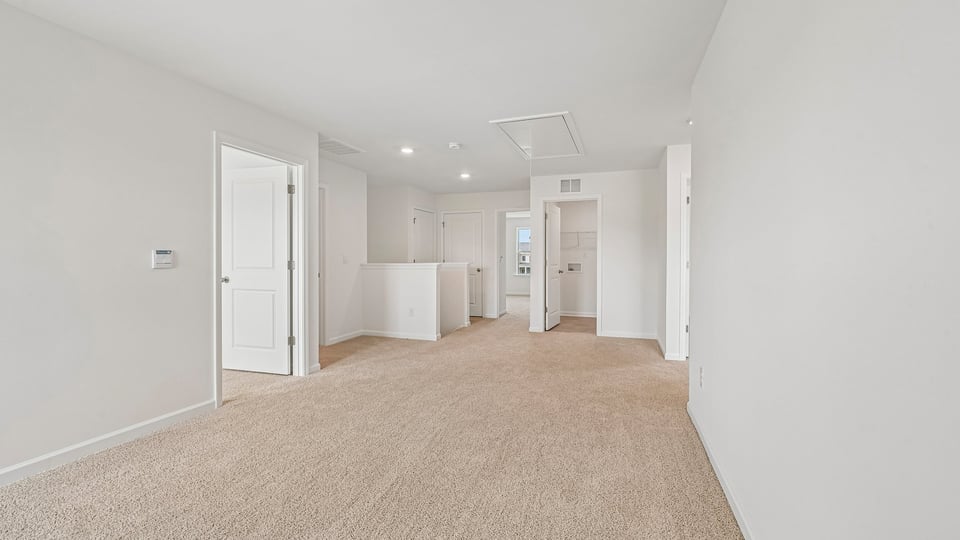 loft with carpet flooring
