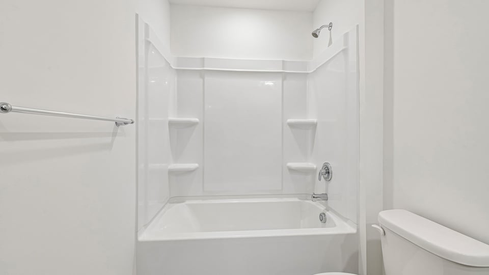 bathroom with tub shower combo