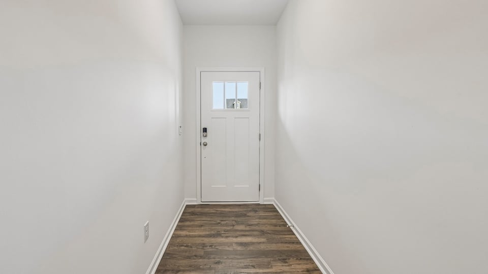 foyer entryway with revwood flooring
