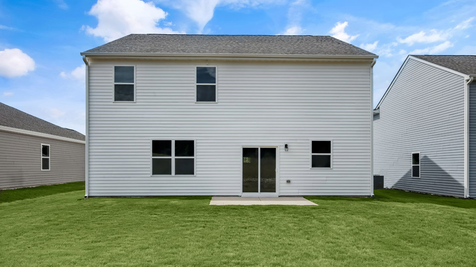 back exterior of Hanover A3 with concrete patio
