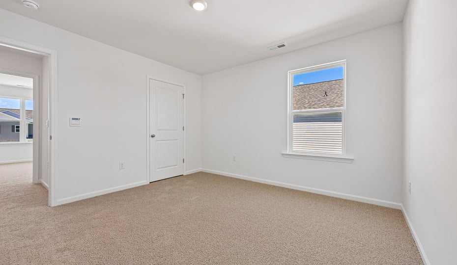 loft with carpet flooring