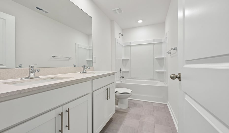 bathroom with tub shower combo