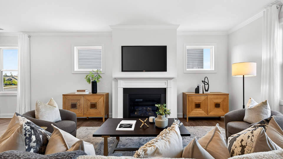 open concept living space with large windows, fireplace
