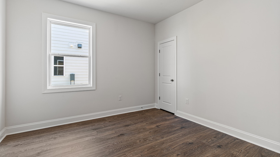 Bedroom with revwood flooring