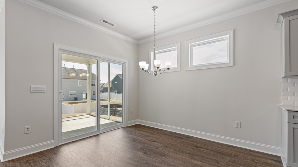 Open-concept dining area with revwood flooring