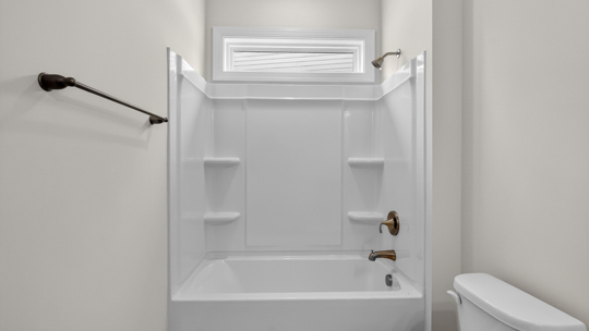 secondary bathroom with shower tub combo and single vanity sink