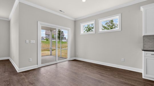 open concept dining space with door to patio