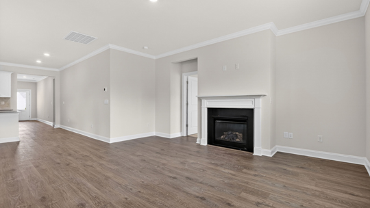 open concept living space with large windows, fireplace