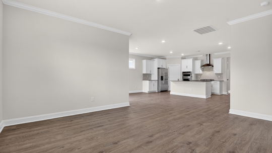 open concept living space with large windows, fireplace