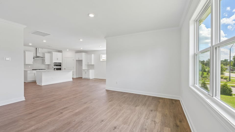 open concept living space with large windows, fireplace