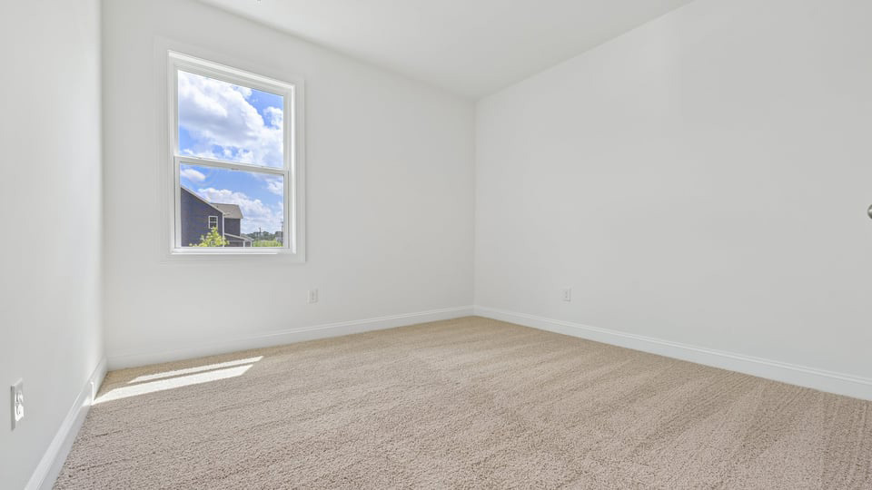 additional bedroom with window, carpeting, closet
