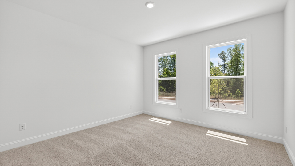 additional bedroom with window, carpeting, closet