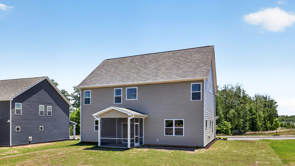 Lucas H back exterior with large yard and enclosed patio