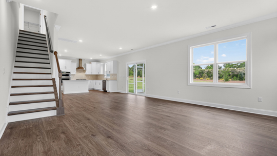 bottom of stairs with revwood flooring