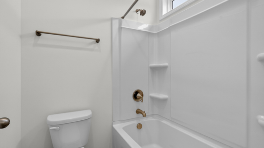 bathroom with tub shower combo