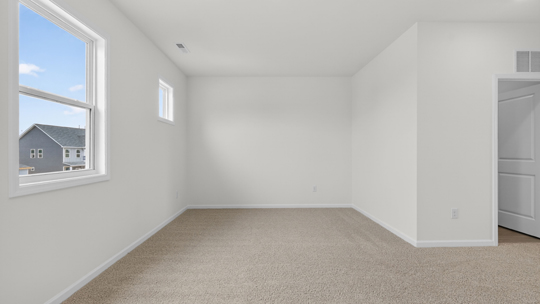 loft with carpet flooring