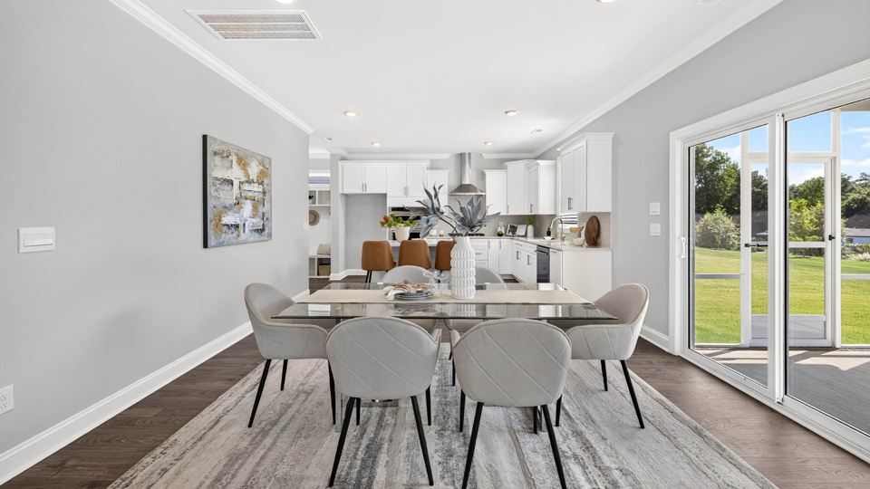 open concept dining area overlooked by kitchen