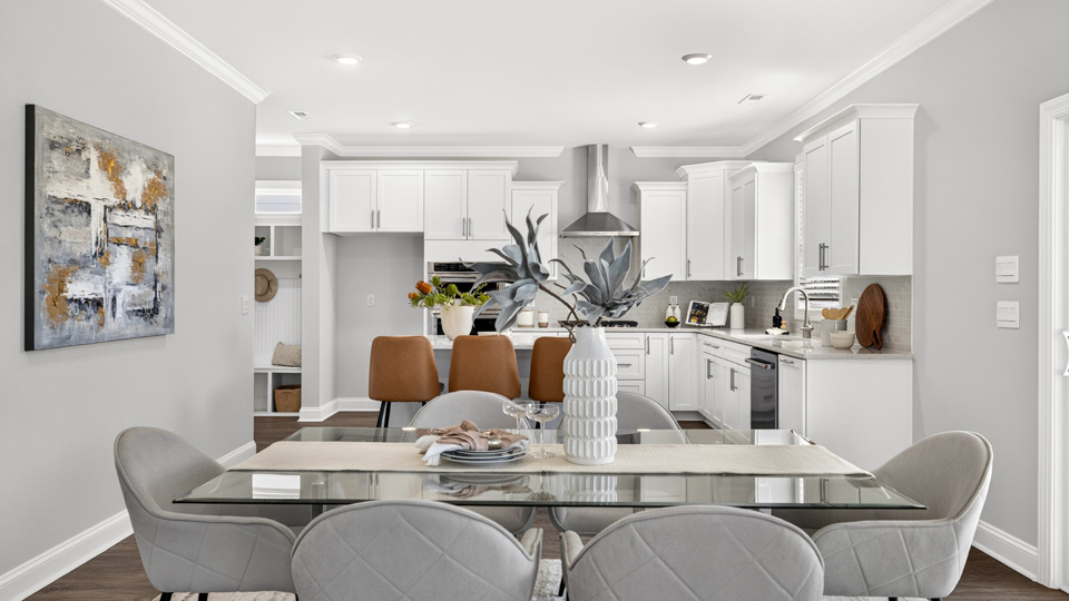 open concept dining area overlooked by kitchen