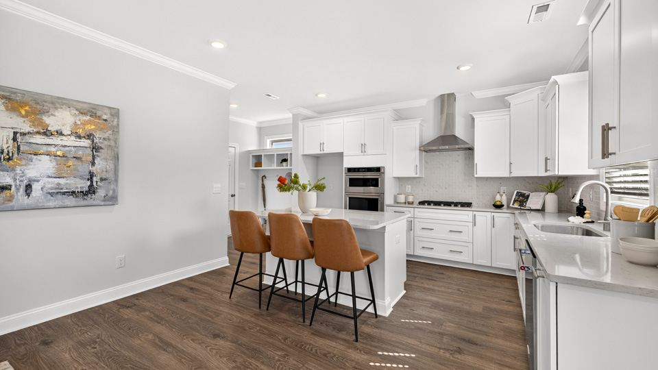 kitchen with island white cabinets and quartz countertops