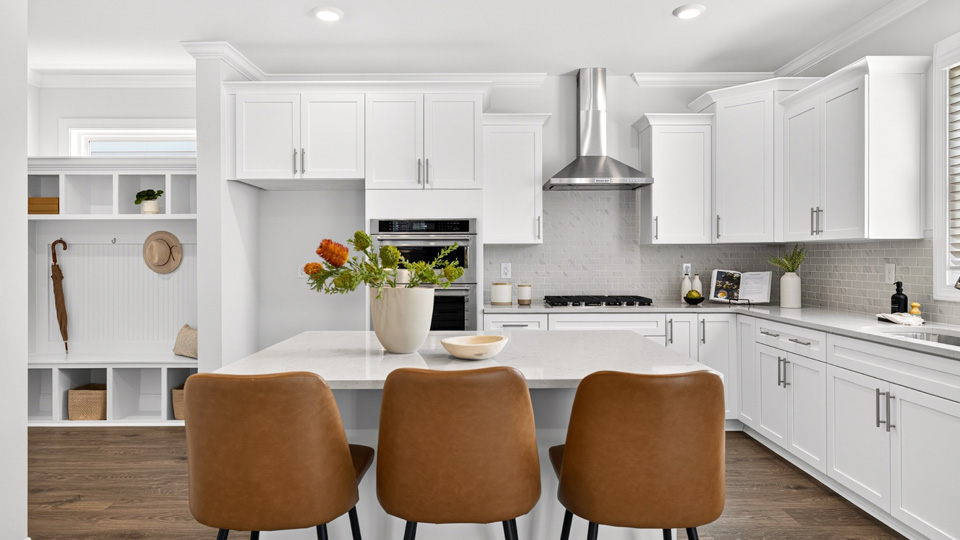 kitchen with island white cabinets and quartz countertops