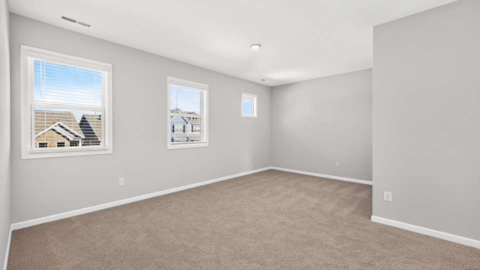 loft with carpet flooring