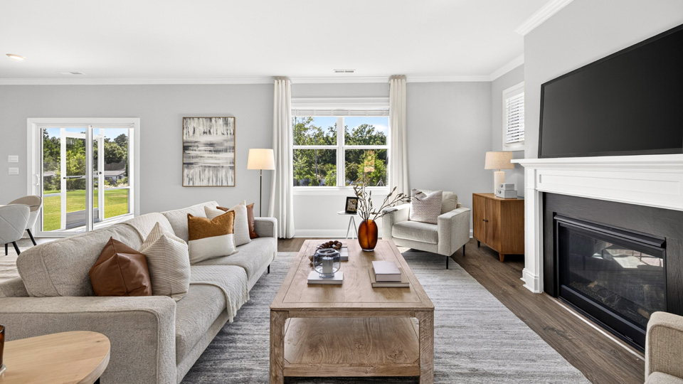 living room with fireplace and lots of natural lighting