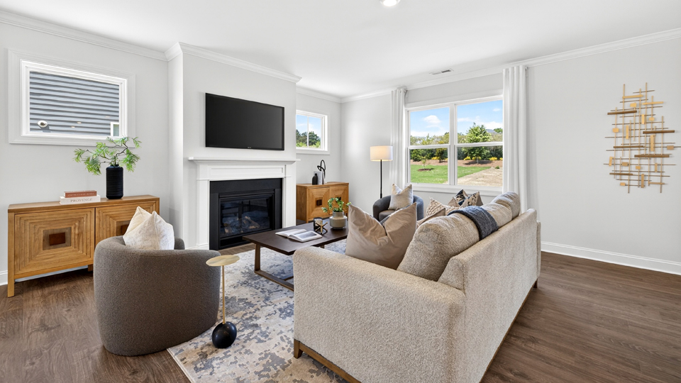 open concept living space with large windows, fireplace