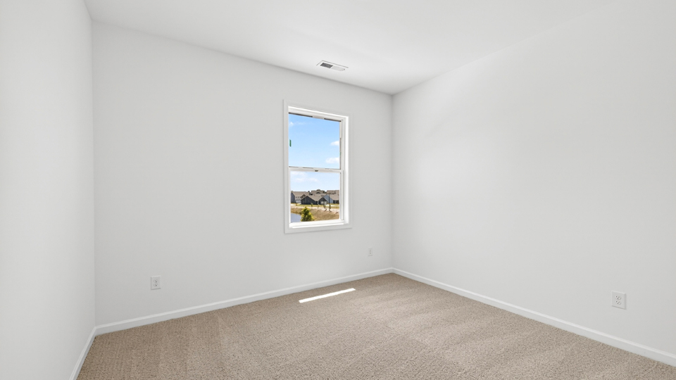 additional bedroom with window, carpeting, closet