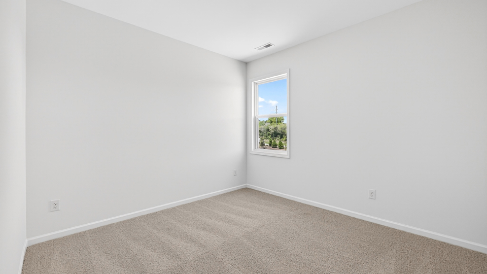 additional bedroom with window, carpeting, closet
