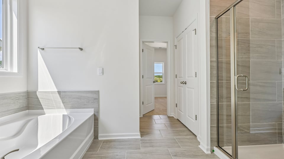 bathroom with separate tub and shower