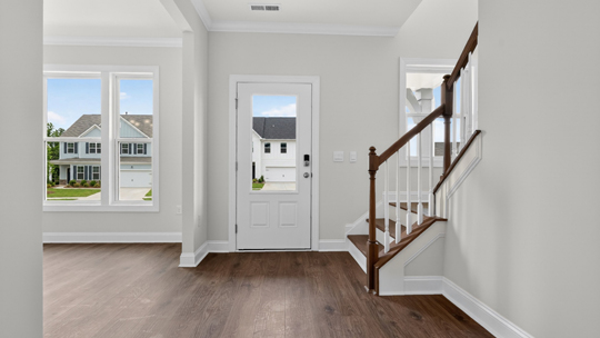 foyer entryway with revwood flooring