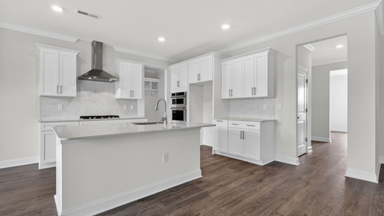 kitchen with island white cabinets quartz countertops