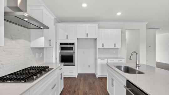 kitchen with island white cabinets quartz countertops